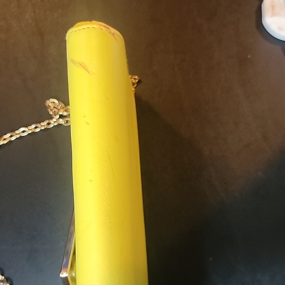 Aldo Yellow Clutch some spots.  Has a snap closure and chain shoulder strap - Picture 5 of 8